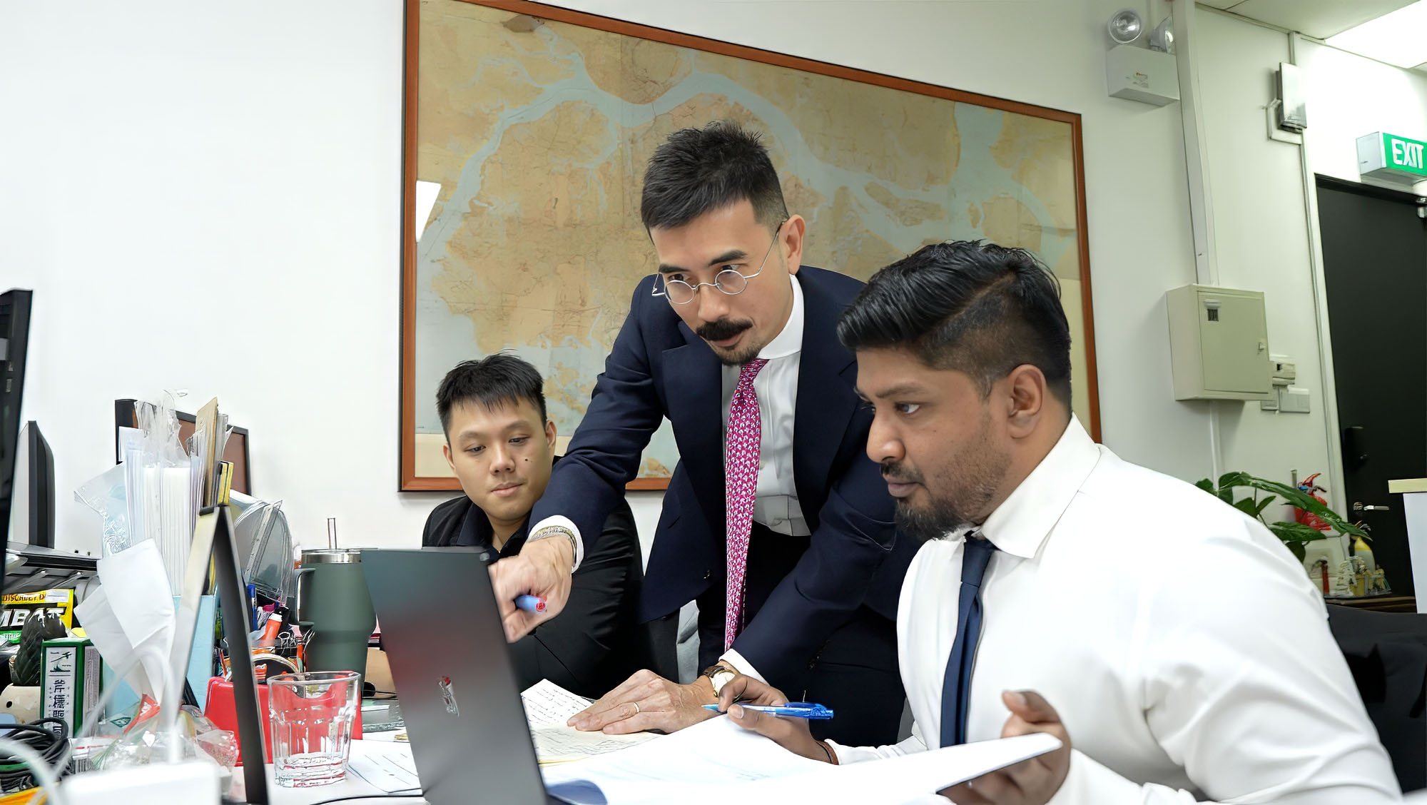 Jonathan Wong in discussion with his team